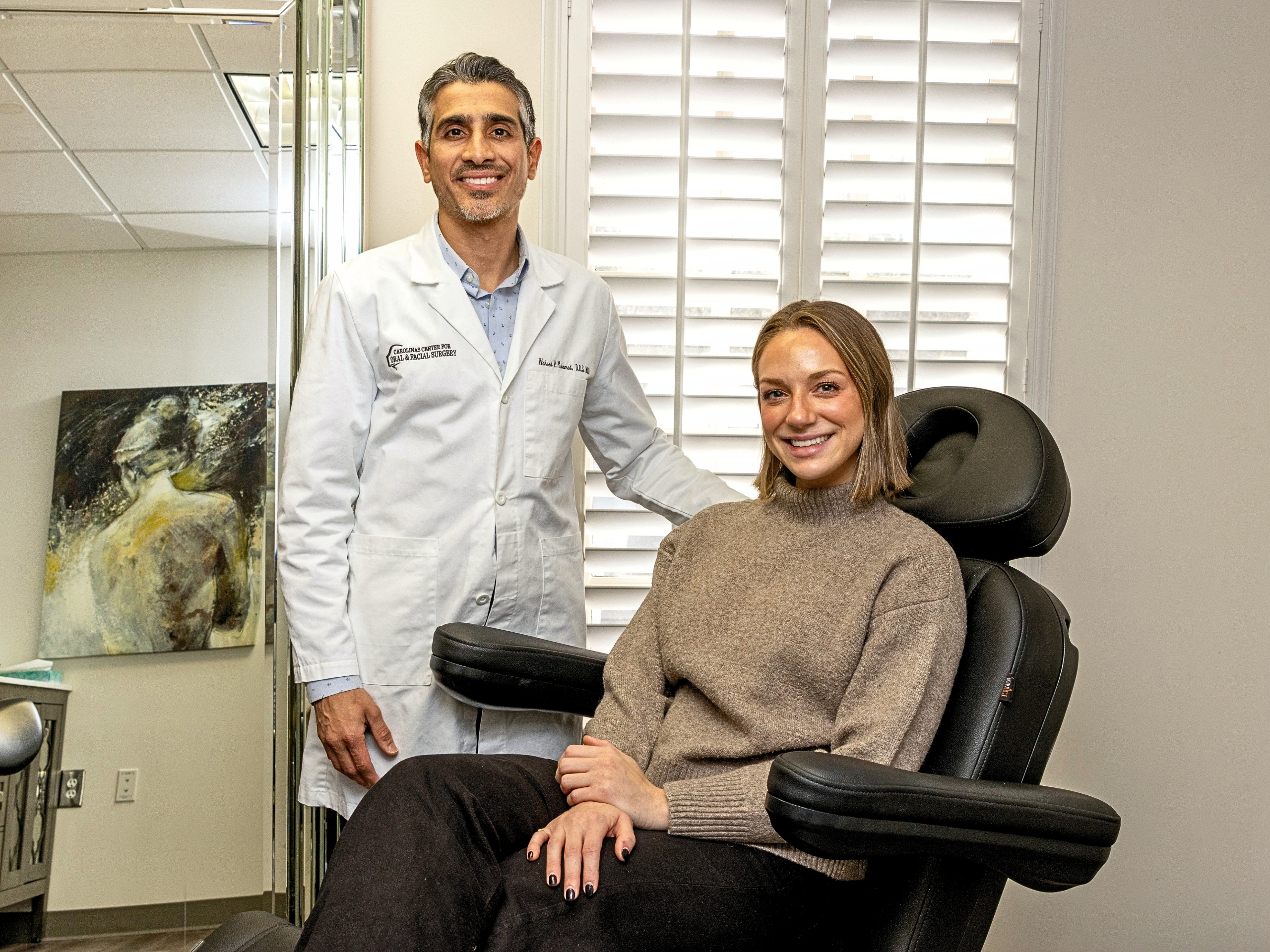 Dr. Waheed Mohamed Oral & Maxillofacial Cosmetic Surgeon in Charlotte, NC with a patient.