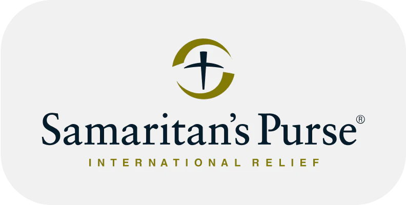 Logo of Samaritan's Purse with a stylized cross icon and text reading "Samaritan's Purse International Relief" on a white background.