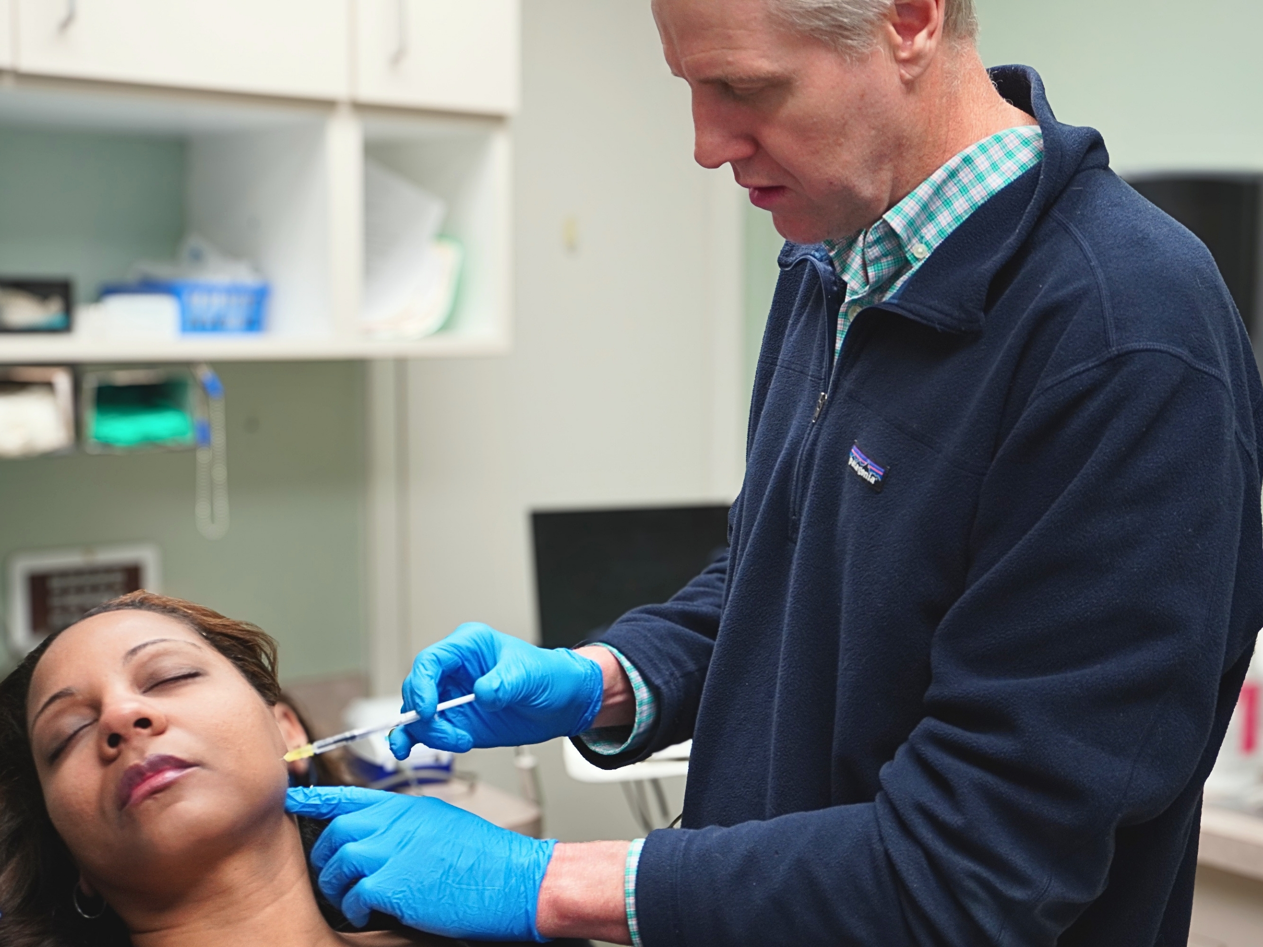 Dr. Reitter Oral and Maxillofacial Surgeon in Charlotte, NC injecting botox for TMJ.