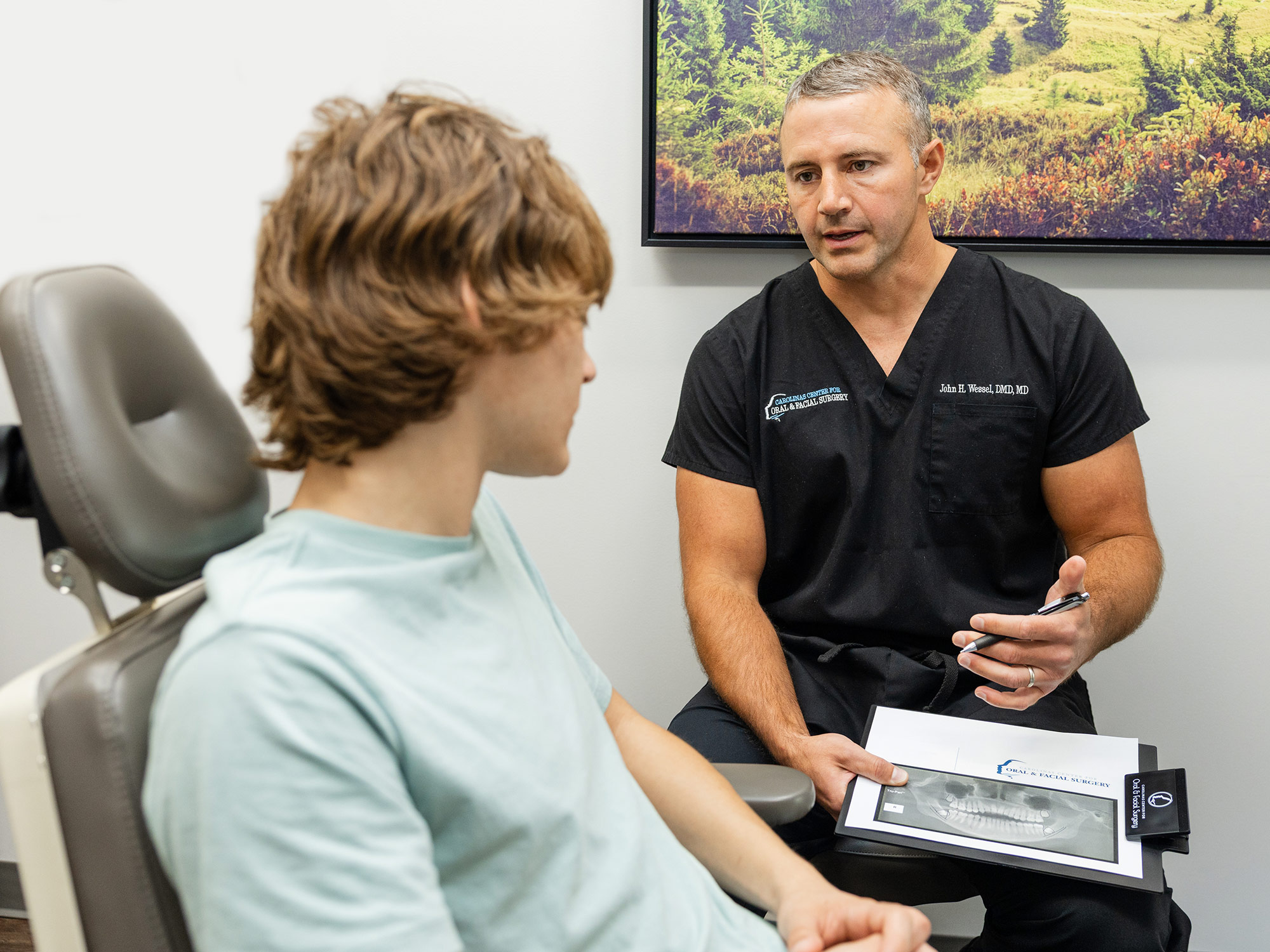 Dr. Wessel, oral & maxillofacial surgeon in Rock Hill, SC with patient