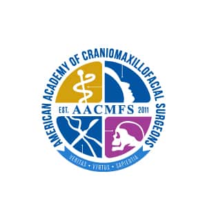 Circular emblem for American Academy of Craniomaxillofacial Surgeons, featuring medical and anatomical symbols with text: "Veritas," "Virtus," "Sapientia." Established 2011.